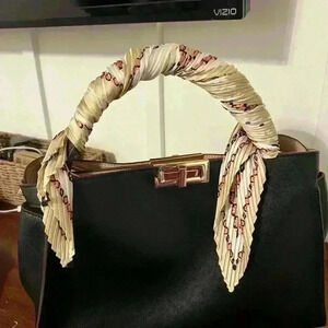 Elegant Black Handbag with Cream Handle